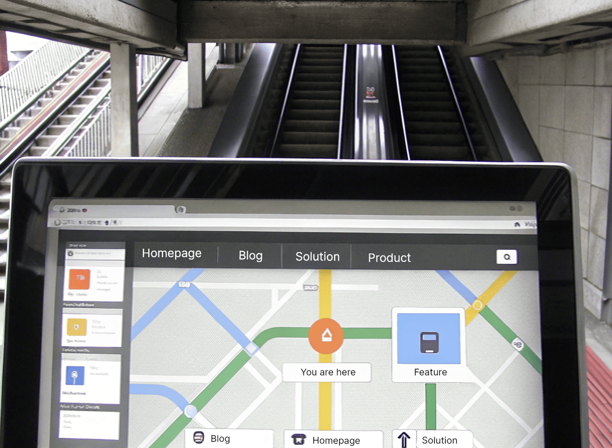 Laptop with navigational transportation map on screen, placed at the bottom of an escalator in a metro station.